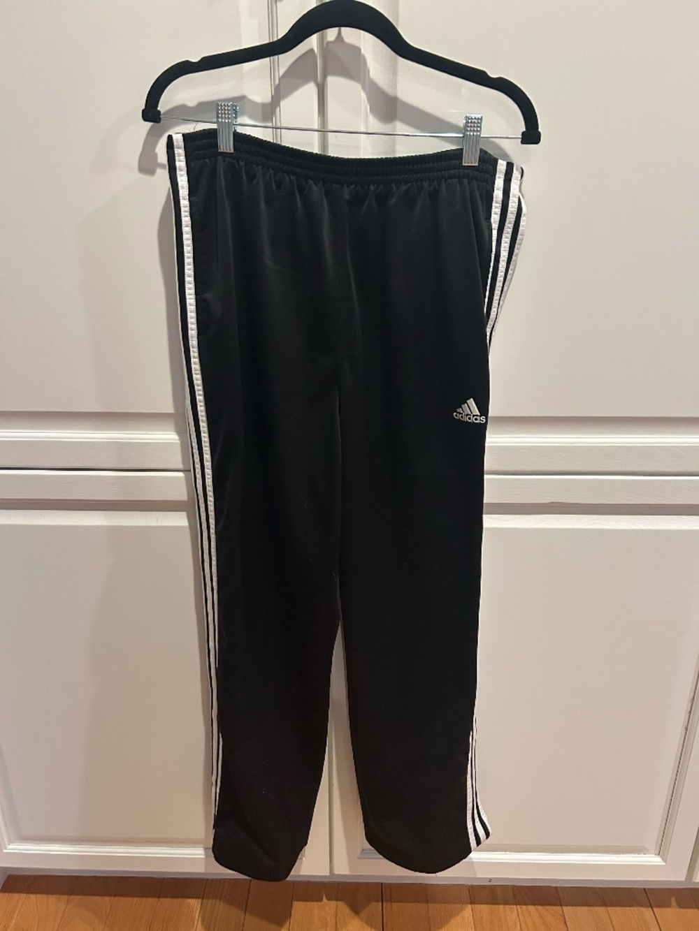 Women’s large adidas track pants with pockets and snaps down the side